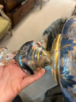 Lot 323 - A pair of enamel and parcel-gilt glass candlesticks
