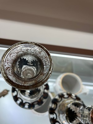 Lot 323 - A pair of enamel and parcel-gilt glass candlesticks
