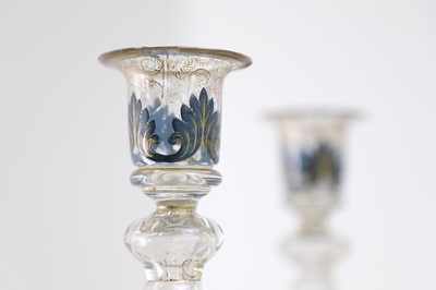 Lot 323 - A pair of enamel and parcel-gilt glass candlesticks