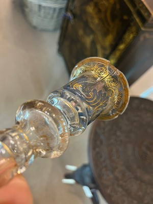 Lot 323 - A pair of enamel and parcel-gilt glass candlesticks