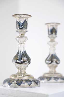Lot 323 - A pair of enamel and parcel-gilt glass candlesticks