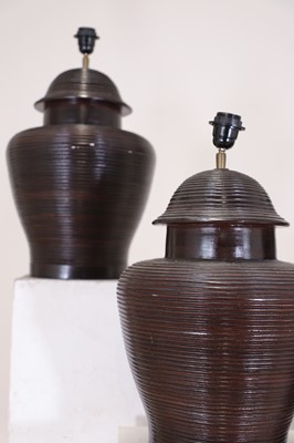 Lot 484 - A set of four glazed pottery table lamp bases