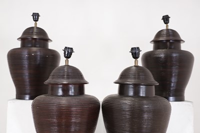 Lot 484 - A set of four glazed pottery table lamp bases