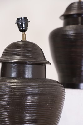 Lot 484 - A set of four glazed pottery table lamp bases