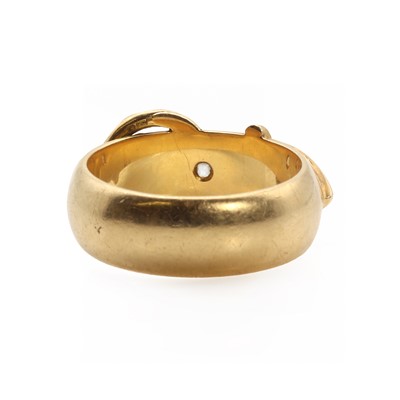 Lot 1027 - An 18ct gold diamond set  buckle ring
