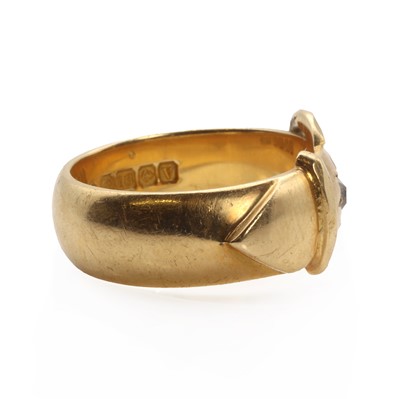 Lot 1027 - An 18ct gold diamond set  buckle ring