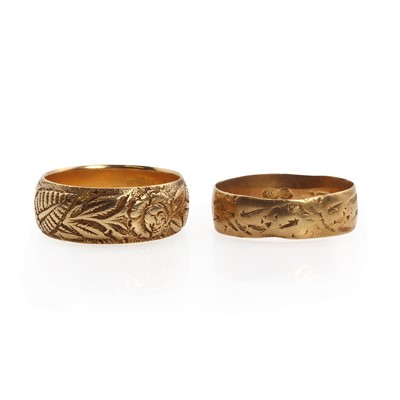 Lot 1238 - Two 18ct gold textured band rings