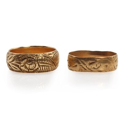 Lot 1238 - Two 18ct gold textured band rings