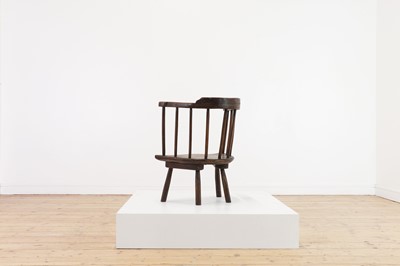 Lot 134 - An elm yoke-back stick chair