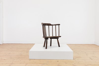 Lot 134 - An elm yoke-back stick chair