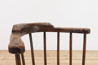 Lot 134 - An elm yoke-back stick chair