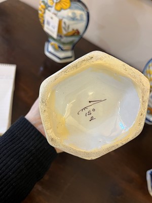 Lot 118 - A delftware tin-glazed earthenware garniture
