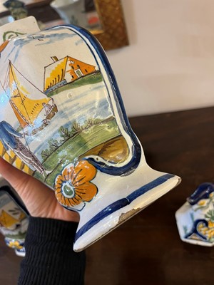 Lot 118 - A delftware tin-glazed earthenware garniture