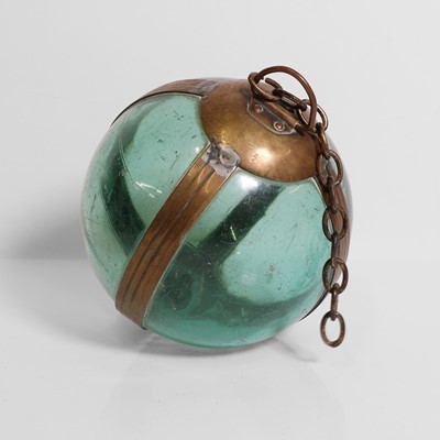 Lot 31 - A brass-mounted pale-green glass buoy or fishing float