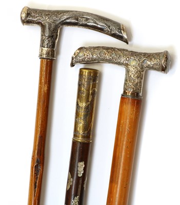 Lot 226 - A group of three Japanese silver mounted handle sticks