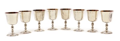 Lot 1 - A set of eight silver and silver-gilt goblets
