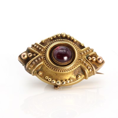 Lot 1013 - A Victorian garnet set shield form brooch of navette shape c.1890