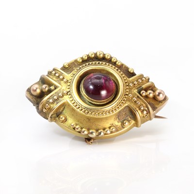 Lot 1013 - A Victorian garnet set shield form brooch of navette shape c.1890