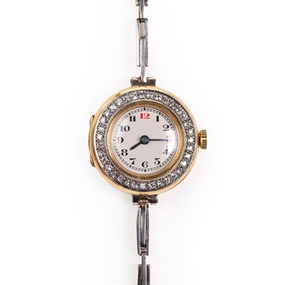 Lot 334 - A ladies 18ct gold diamond set mechanical bracelet watch, c.1913