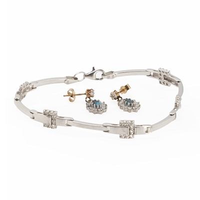 Lot 1291 - A 9ct white gold bracelet and a pair of blue topaz earrings