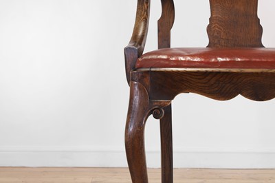 Lot 142 - A large George II-style oak armchair