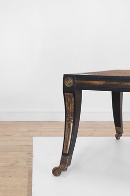 Lot 133 - An Empire-style ebonised and parcel-gilt wooden stool
