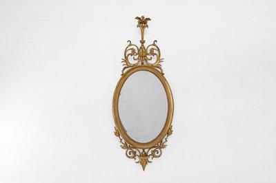 Lot 6 - A George III-style giltwood and gesso oval mirror