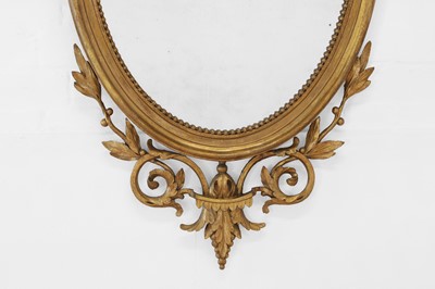 Lot 6 - A George III-style giltwood and gesso oval mirror