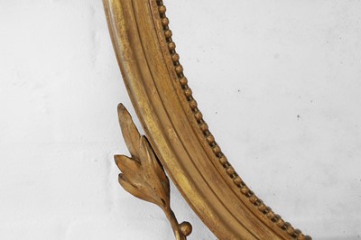 Lot 6 - A George III-style giltwood and gesso oval mirror
