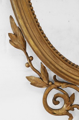Lot 6 - A George III-style giltwood and gesso oval mirror