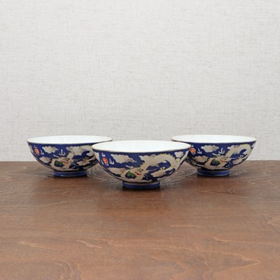 Lot 74 - Three Chinese blue-ground white-enamelled bowls