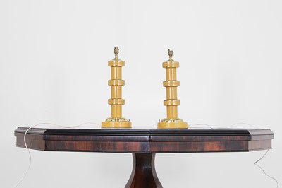 Lot 135 - A pair of painted metal lamps