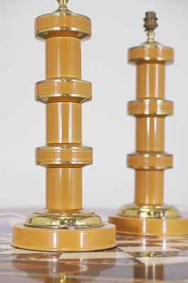Lot 135 - A pair of painted metal lamps