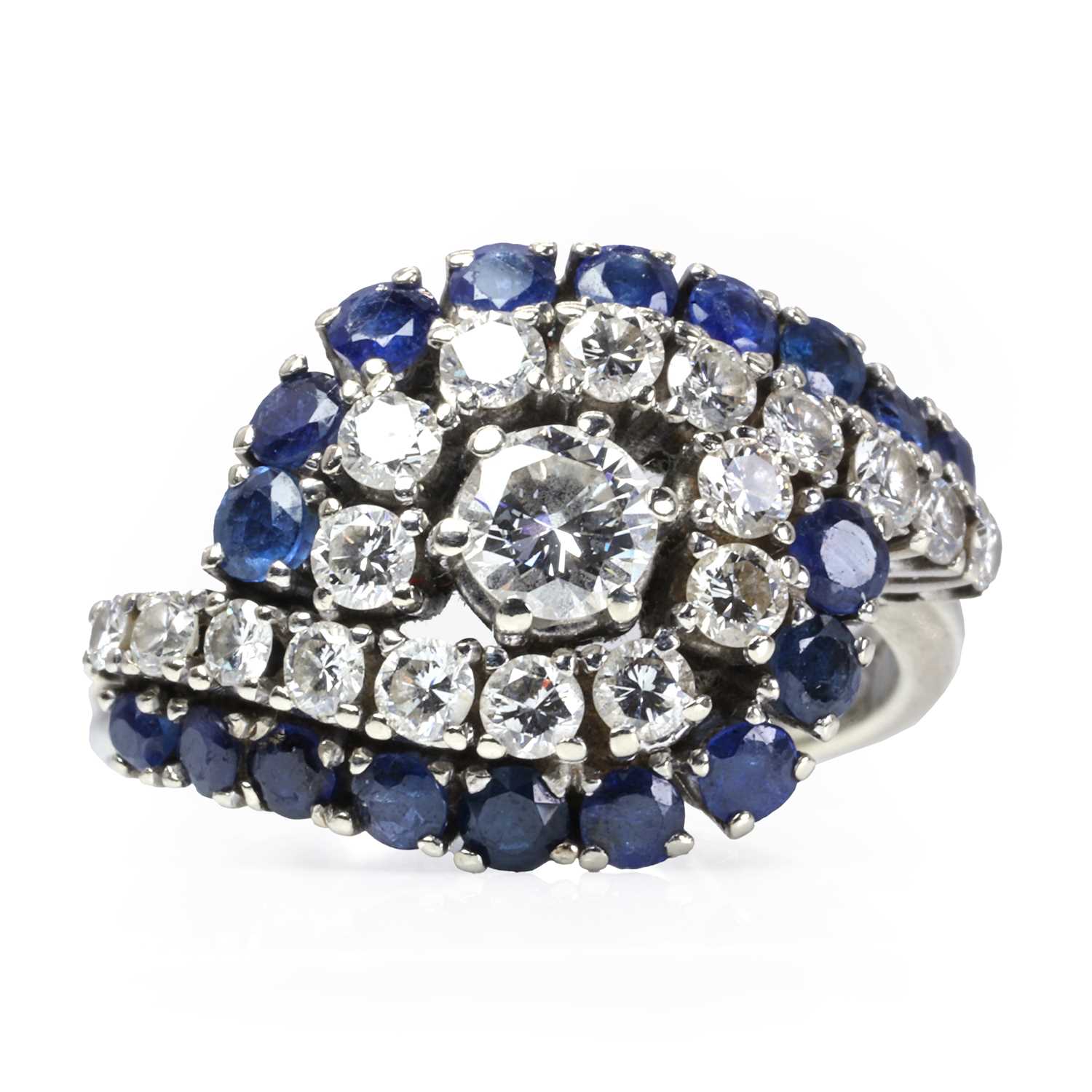 Lot 85 - A white gold sapphire and diamond crossover ring