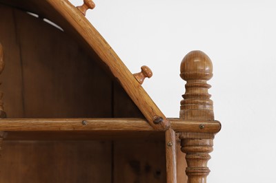 Lot 140 - A set of fruitwood and pine wall-hanging shelves