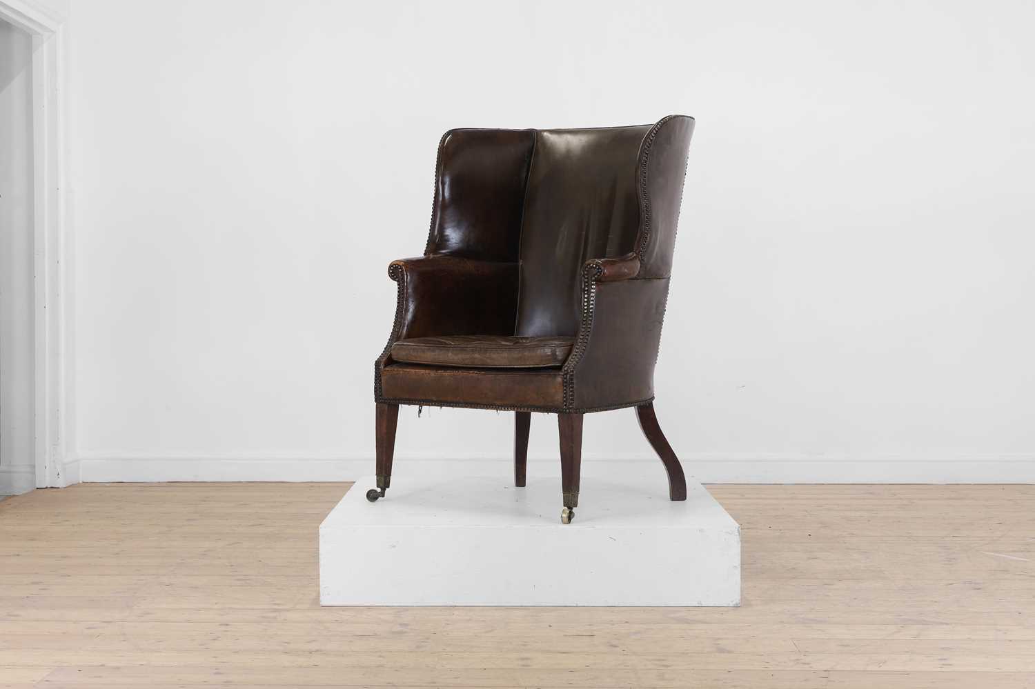 Lot 113 - A George III mahogany barrel-back armchair