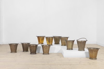 Lot 405 - A set of eleven brass buckets