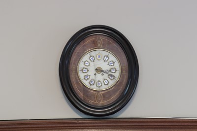 Lot 50 - A French eight-day striking wall clock