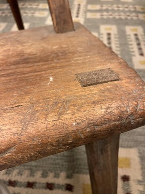 Lot 28 - A primitive elm joined bench