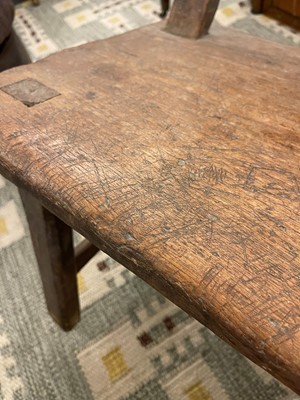 Lot 28 - A primitive elm joined bench