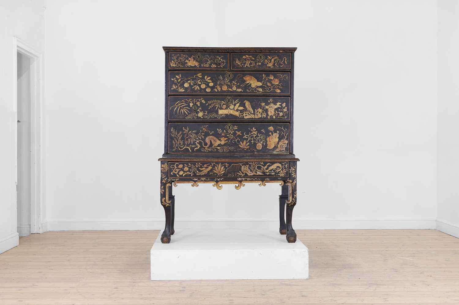 Lot 13 - A black lacquer and gilt-japanned chest on stand