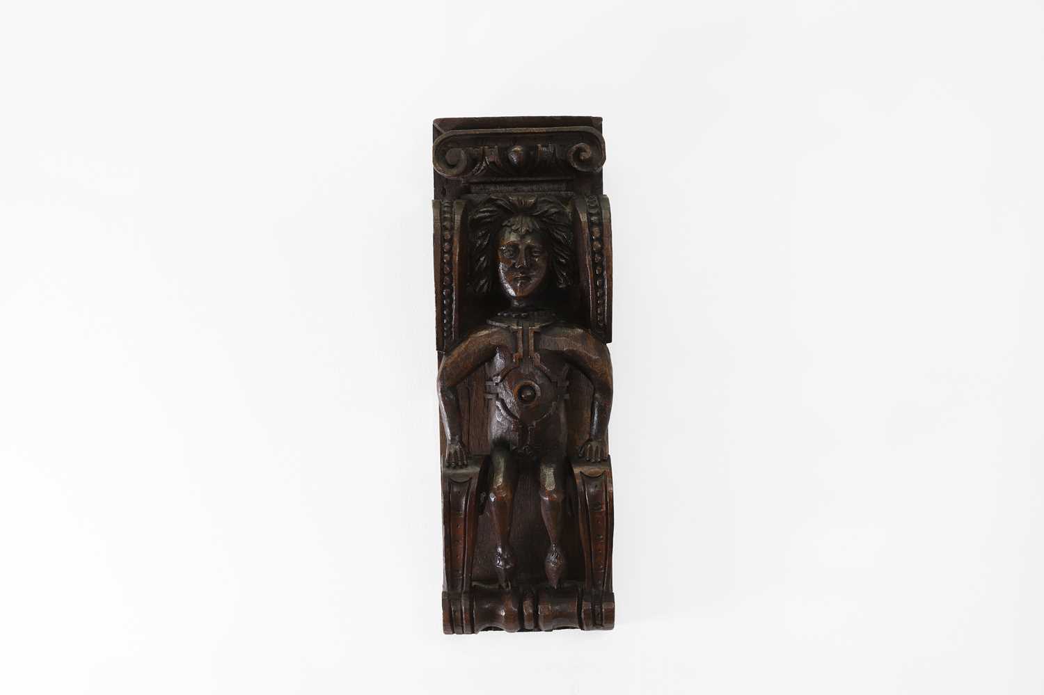 Lot 73 - A carved oak corbel