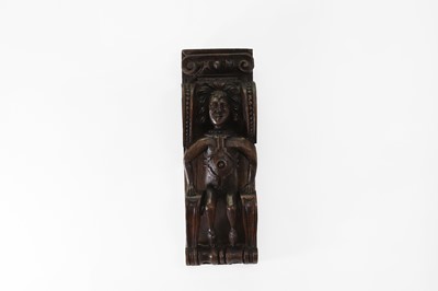 Lot 73 - A carved oak corbel
