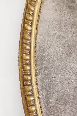 Lot 359 - A George III giltwood oval mirror