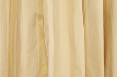 Lot 225 - A pair of pale gold striped silk curtains