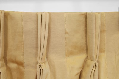 Lot 225 - A pair of pale gold striped silk curtains