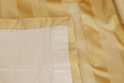 Lot 225 - A pair of pale gold striped silk curtains