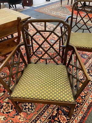 Lot 66 - A set of four George III-style mahogany 'cockpen' elbow chairs