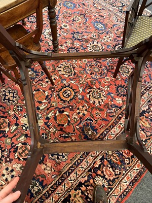 Lot 66 - A set of four George III-style mahogany 'cockpen' elbow chairs