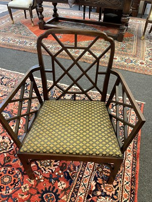 Lot 66 - A set of four George III-style mahogany 'cockpen' elbow chairs